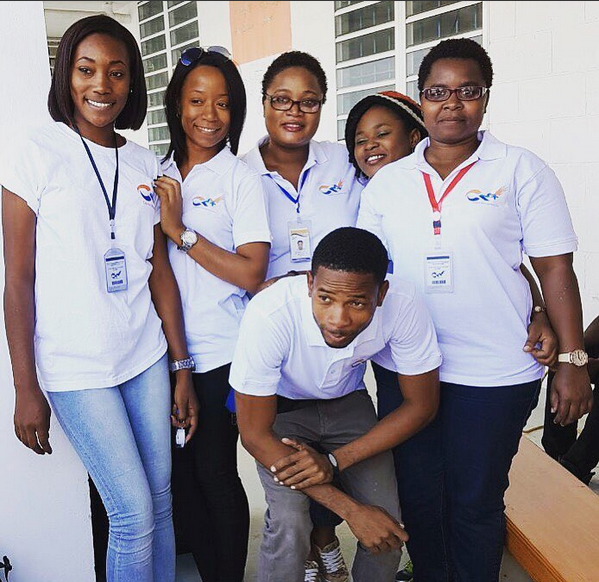 Team members in white shirts at community event
